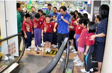  ??  ?? A file photo showing practical training for children on safe use of escalators during the Safety and Health (SH) Week 2017. The programme was organised by DOSH Sibu in collaborat­ion with Sanyan complex to improve awareness of escalator safety among children and parents.