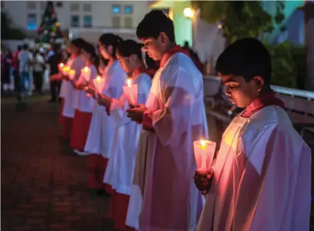  ?? Victor Besa / The National ?? Christian choristers attend Midnight Mass at St Joseph’s Cathedral in Abu Dhabi