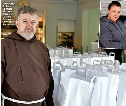  ??  ?? FOOD aiD: Fr Seán Donohoe with food parcels at Dublin’s Capuchin Day Centre this week