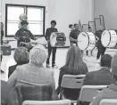  ?? ?? The Freire Charter Wilmington drumline performs as the school holds a ribbon cutting for its new athletics center on Wednesday.