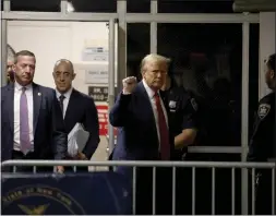  ?? JEFFERSON SIEGEL — THE NEW YORK TIMES ?? Former President Donald Trump raises a fist outside the courtroom as he returns from lunch in his criminal trial at Manhattan Criminal Court in Manhattan.