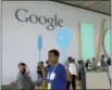  ?? JEFF CHIU / AP FILE ?? A Google employee helps direct people as they register for Google I/O 2014 in San Francisco.