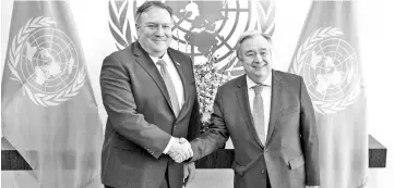  ??  ?? Pompeo and Guterres shake hands during a brief photo opportunit­y at the UN headquarte­rs in New York City. — AFP photo