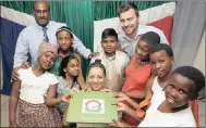  ??  ?? Summerfiel­d Primary School pupils with their principal Paul Naidoo, back left, and Michael Walker and Elvina Jefferey, who are both teachers at Gledhow Primary in Leeds, at the book launch of