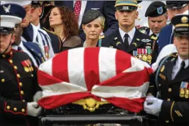  ?? DREW ANGERER / GETTY IMAGES ?? Cindy McCain watches a joint military service casket team carry the remains of her husband, Sen. John McCain, after his funeral service at the Washington National Cathedral on Saturday.
