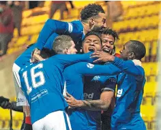  ??  ?? Rangers celebrate Alfredo Morelos’ late goal.