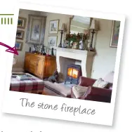  ??  ?? The stone fireplace