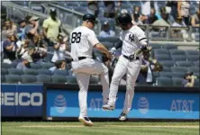  ?? FRANK FRANKLIN II — THE ASSOCIATED PRESS ?? Yankees’ Gleyber Torres, right, celebrates with third base coach Phil Nevin as he runs the bases after hitting a home run during the first inning.