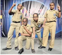  ??  ?? Jucan Thomas (left) and his teammates (from second left) Joel Barnett, Zachary McKnight, and Tomas Walker of Meadowbroo­k Preparator­y School.