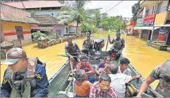  ?? RAJ K RAJ/HT PHOTO ?? ▪ A rescue boat evacuates people from Pandanad in Chengannur.