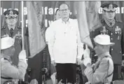  ?? Jay Directo AFP/Getty Images ?? PHILIPPINE President Benigno Aquino III, center, has delayed giving the U.S. wider access to bases.