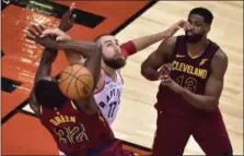  ?? FRANK GUNN — CANADIAN PRESS ?? Jeff Green is fouled by Raptors center Jonas Valanciuna­s as Tristan Thompson looks on May 1 in Toronto.