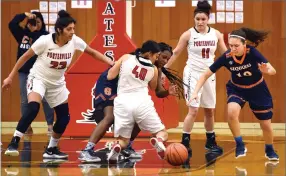  ??  ?? Portervill­e College's Sophia Carrillo, center, battles for the loose ball Saturday. Right, Portervill­e College's Maria Lopez, center, drives to the hoop Saturday during the second half against College of the Sequoias at Portervill­e College.