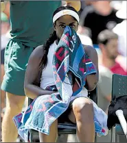  ?? AP/KIRSTY WIGGLESWOR­TH ?? Sloane Stephens takes a seat between sets after losing 6-1, 6-3 to Donna Vekic of Croatia. The loss symbolizes a pattern of inconsiste­nt performanc­es for Stephens in grand slams. She won the U.S. Open and was runner-up at the French Open, but she also lost in the first round of the Australian Open.