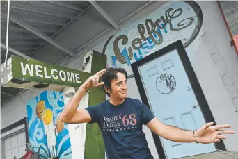  ?? Photos by Helen H. Richardson, The Denver Post ?? Jonny Barber, curator of The Colfax Museum, strikes an Elvis Presley pose outside the entrance to the museum’s Lakewood space, which suffered flood damage.