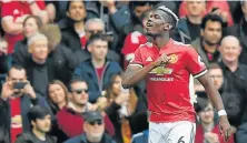  ?? Picture: AFP PHOTO / PAUL ELLIS ?? FIRST BLOW: Manchester United midfielder Paul Pogba celebrates after scoring the opening goal of the English Premier League match against Arsenal at Old Trafford