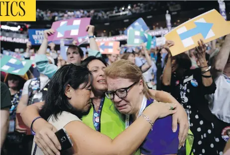  ?? JOHN LOCHER / THE ASSOCIATED PRESS ?? From left, delegates Carrie Pugh, Katrina Mendiola and Mayors Wegmann cry as Hillary Clinton was officially announced as the first woman to become the presidenti­al nominee of a major U.S. political party at the Democratic National Convention in...