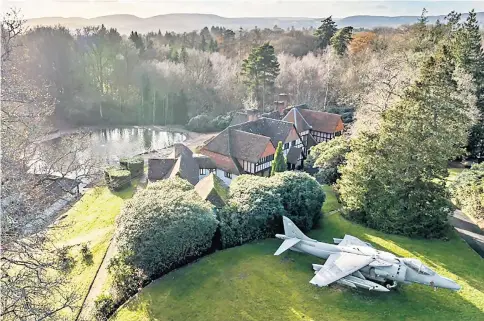  ?? ?? The 46ft-by-29ft aircraft sits on a grass verge outside Peter Robinson’s six-bedroom country house in Hampshire