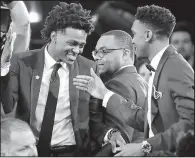  ?? AP/FRANK FRANKLIN II ?? De’ Aaron Fox (left. is greeted by his college teammate Malik Monk after Fox was taken fifth overall by Sacramento. Monk was chosen six picks later by Charlotte.