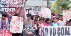  ??  ?? HUMAN rights advocates and Indigenous Peoples hold a rally in Koronadal City, in front of the provincial capitol of South Cotabato on December 11, 2017 to protest the killing of Datu Victor Danyan and seven others in the village of Ned in Lake Sebu town on December 3. MindaNews photo by BONG S. SARMIENTO