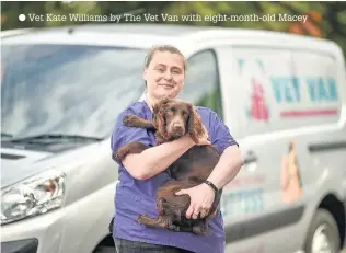  ??  ?? Vet Kate Williams by The Vet Van with eight-month-old Macey