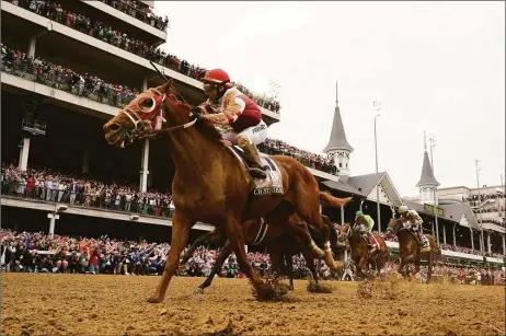  ?? Jeff Roberson / Associated Press ?? Rich Strike, with Sonny Leon riding, won the Kentucky Derby at Churchill Downs in Louisville, Ky., on Saturday. The race, which was carried on the NBC network and digital platforms, was watched by an average of 16 million viewers.