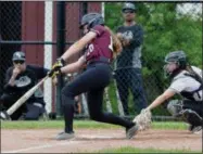  ??  ?? Stockbridg­e Valley first baseman Abby Reed follows through on an RBI single in the bottom of the sixth during a 2-0win over Belleville-Henderson on Thursday, May 30.