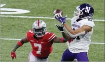  ??  ?? Northweste­rn wide receiver Ramaud Chiaokhiao-bowman (81) catches a pass as Ohio State cornerback Sevyn Banks (7) defends during the second half of Saturday’s game.