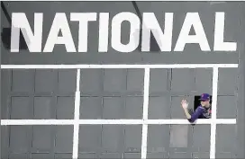  ?? CHARLES REX ARBOGAST/ASSOCIATED PRESS ?? New York Mets pitcher Jacob deGrom waves from the scoreboard Monday during a team workout in preparatio­n for today’s Game 3 in the NL Championsh­ip Series against the Cubs in Chicago.