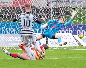  ?? ?? Josh McPake finds the net past Jamie Sneddon to put Queen’s Park three up