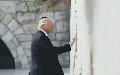  ??  ?? President Donald Trump at the Western Wall in Jerusalem; Mr Trump is trying to revive talks between Israel and the Palestinia­ns.