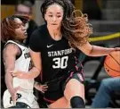  ?? ?? David Zalubowski / Associated Press Stanford guard Haley Jones, right, drives past Colorado guard Jaylyn Sherrod Thursday. Jones scored 13 of her 23 points in overtime.