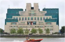  ?? — Reuters ?? A motorboat passes by the MI6 building in London.