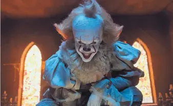  ?? BROOKE PALMER/WARNER BROS. PICTURES ?? Bill Skarsgard portrays Pennywise, the villainous clown in “It.” The New Line/Warner Bros. release took in $117.2 million in its opening week, shattering records for a horror film and a September release.