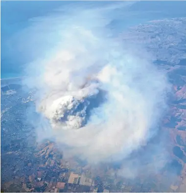  ??  ?? The 50-metre tall fire tornado was hidden by ‘‘that big mushroom cloud’’ of smoke, says fire response co-ordinator Richard McNamara.