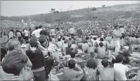  ?? AP ?? This Aug. 14, 1969 photo shows a portion of the 400,000 concert goers who attended the Woodstock Music and Arts Festival held on a 600acre pasture near Bethel, N.Y.