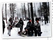  ?? ?? Ski troops on a reconnaiss­ance mission inside a forest