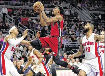  ?? GREGORY SHAMUS / GETTY IMAGES ?? The Heat’s Josh Richardson, who scored nine points, drives at the Pistons’ Tobias Harris.