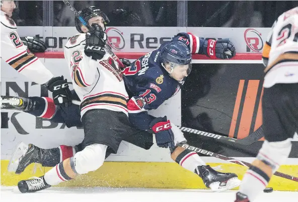  ?? TROY FLEECE ?? Wyatt Sloboshan and his Pats teammates took some lumps in an uneven 4-3 win over Mark Kastelic and the Calgary Hitmen Wednesday night at the Brandt Centre.