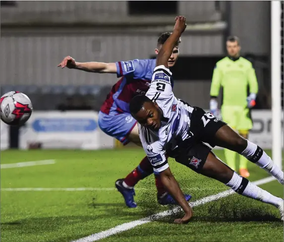  ?? Picture: Sportsfile ?? Luke McNally challenges Dundalk’s Lido Lotefa during the recent Jim Malone Cup game at Oriel Park.