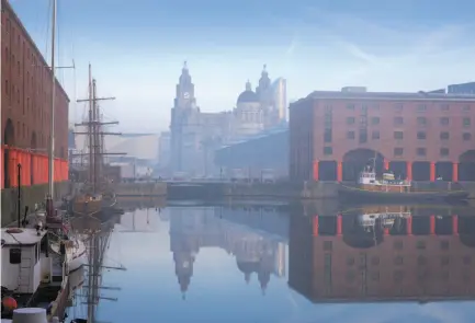  ?? Rod Edwards / VisitBrita­in ?? Above: The renovated brick warehouses of Albert Dock host several museums, as does Pier Head, seen through the mist. Below: The Walker Art Gallery is one of seven free institutio­ns in the National Museums Liverpool collection.