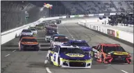  ?? James Gilbert / Getty Images ?? Chase Elliott, driver of the No. 9 NAPA Auto Parts Chevrolet, and Martin Truex Jr., driver of the No. 19 Bass Pro Toyota, race during the NASCAR Cup Series Blue-Emu Maximum Pain Relief 500 at Martinsvil­le Speedway on April 10 in Martinsvil­le, Va.