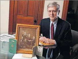  ?? ERIC ALBRECHT/DISPATCH ?? Richard Makowski of Columbus has been researchin­g the internment of his father, Benedict, in a concentrat­ion camp in Germany during WWII. He holds a photograph that shows his grandparen­ts Feliks and Ludwika Makowski with their sons, from left, Joseph,...