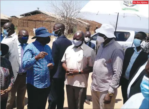  ??  ?? Pic: Rex Mphisa
Vice-President Kembo Mohadi (in white hat) and Local Government minister July Moyo (in khaki shirt) during a tour of infrastruc­ture built under the Beitbridge Redevelopm­ent Project in the border town yesterday