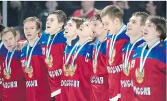  ?? — THE CANADIAN PRESS ?? Russia celebrates downing Sweden 2-1 in overtime Thursday in Montreal to win bronze.