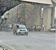  ?? R. PAVAN ?? City witnesses heavy showers after seeing a spike in temperatur­e, on Tuesday. —