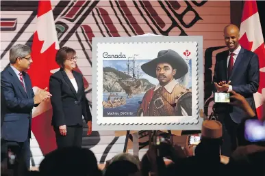  ?? FRED CHARTRAND/THE CANADIAN PRESS ?? Canada Post president Deepak Chopra, left, Minister of Public Services Judy Foote and Immigratio­n Minister Ahmed Hussen unveil a stamp of Mathieu DaCosta at an event celebratin­g Black History Month in Gatineau on Feb. 6.