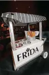  ??  ?? Hard, dry churros arrive in a miniature street cart with four dipping sauces.