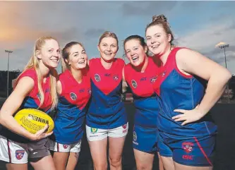 ?? Picture: SAM ROSEWARNE ?? SUPPORT GROWS: Demons Krystal Kelly, left, Katelin Snell, Nicole Shelverton, Jaymee Mansfield and Steph Claridge are keen to see the North Melbourne-Tasmania Kangaroos play at North Hobart. Top left, Nicole Bresnehan in the new jumper.