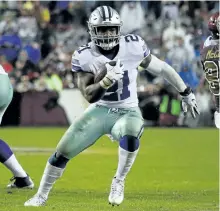  ?? ROB CARR/GETTY IMAGES ?? Dallas Cowboys’ running back Ezekiel Elliott trots up field against the Washington Redskins during the fourth quarter of their game at FedEx Field, on Sunday.